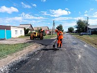 На улице Локомотивной — праздник: дорогу одели в асфальт